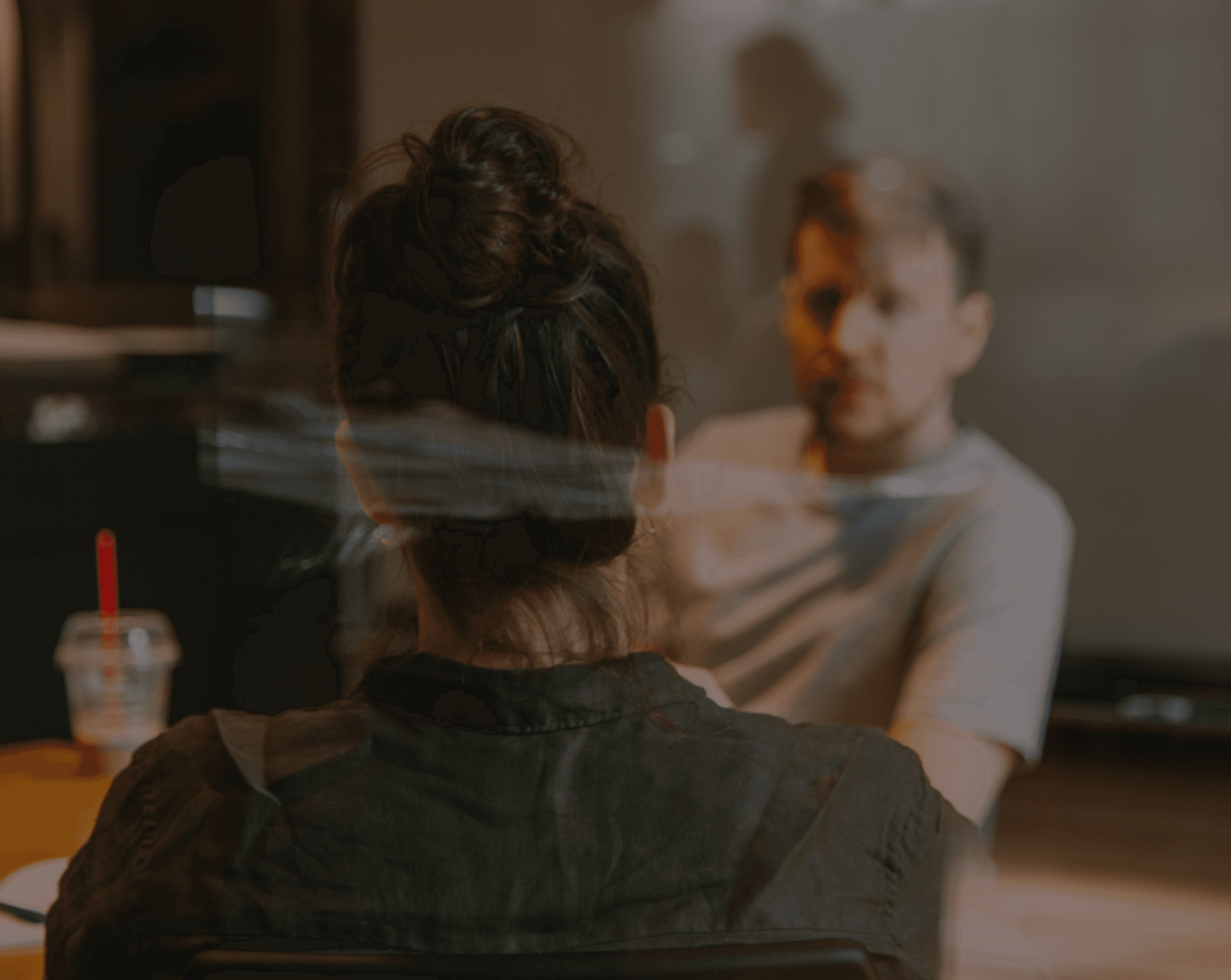 Two people talking in a café